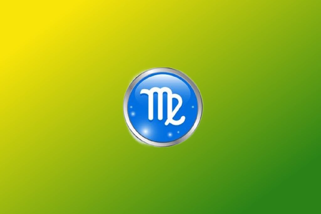 Ilustração do signo de Virgem com símbolo branco curvado semelhante a um M em círculo azul com borda prateada sobre fundo verde e amarelo