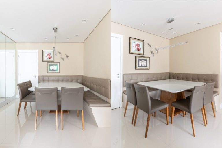 Sala de estar com parede bege-claro, sofá em formato de L, mesa branca e cadeiras à sua frente