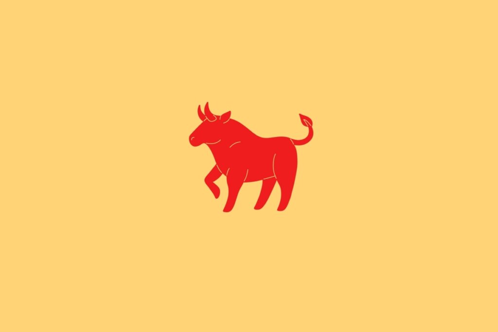 Ilustração do signo de Búfalo em fundo amarelo contendo a figura de um boi vermelho