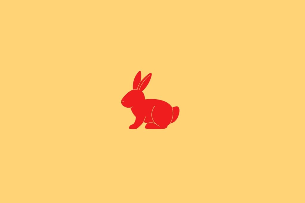 Ilustração do signo de Coelho, em fundo amarelo-claro, contendo a imagem de um coelho em vermelho