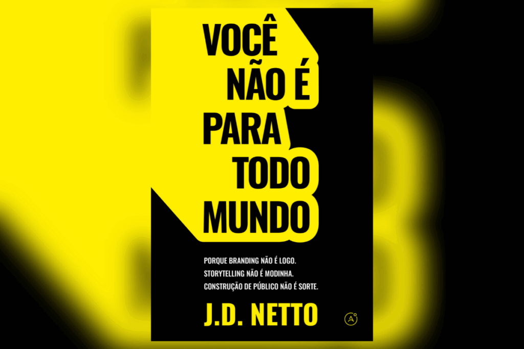 Livro “O mundo é seu, negócio fechado!” com título em letras grandes amarelas sobre fundo preto