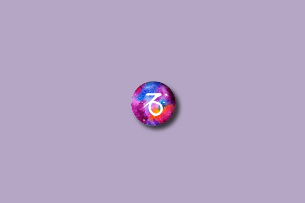 Ilustração do signo de capricórnio em um círculo colorido e sobre um fundo roxo